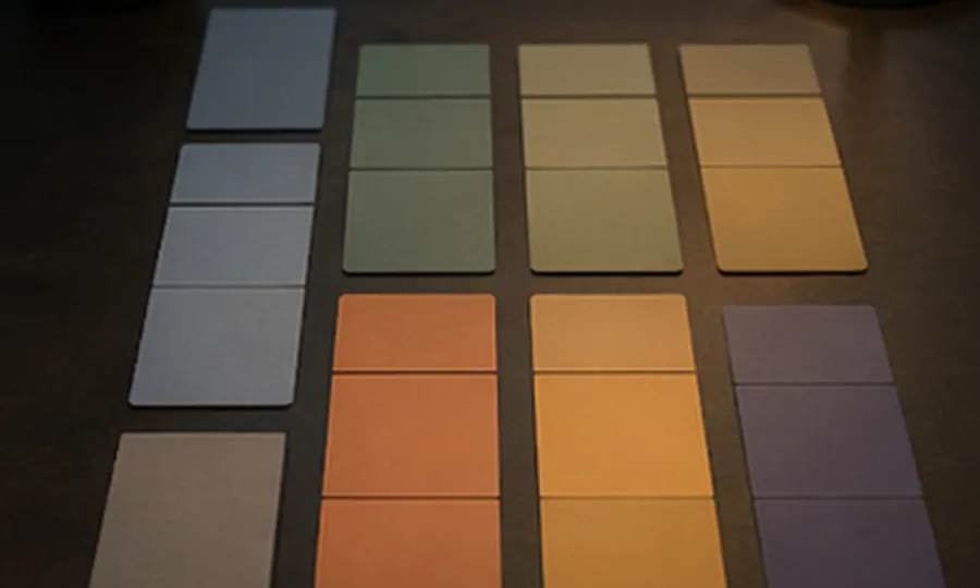 Rhythm lesson art: blank day-block cards laid out from wake to sleep on a dark desk